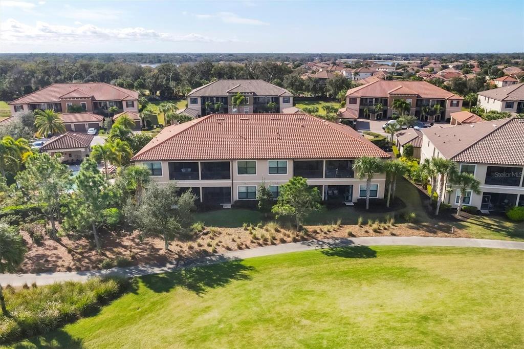 13703 Messina Loop, Unit 104 Bradenton, FL 34211 - Photo 86 of 86 a front view of house with yard and green space
