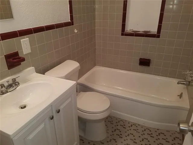 a view of a house with a yard and garage