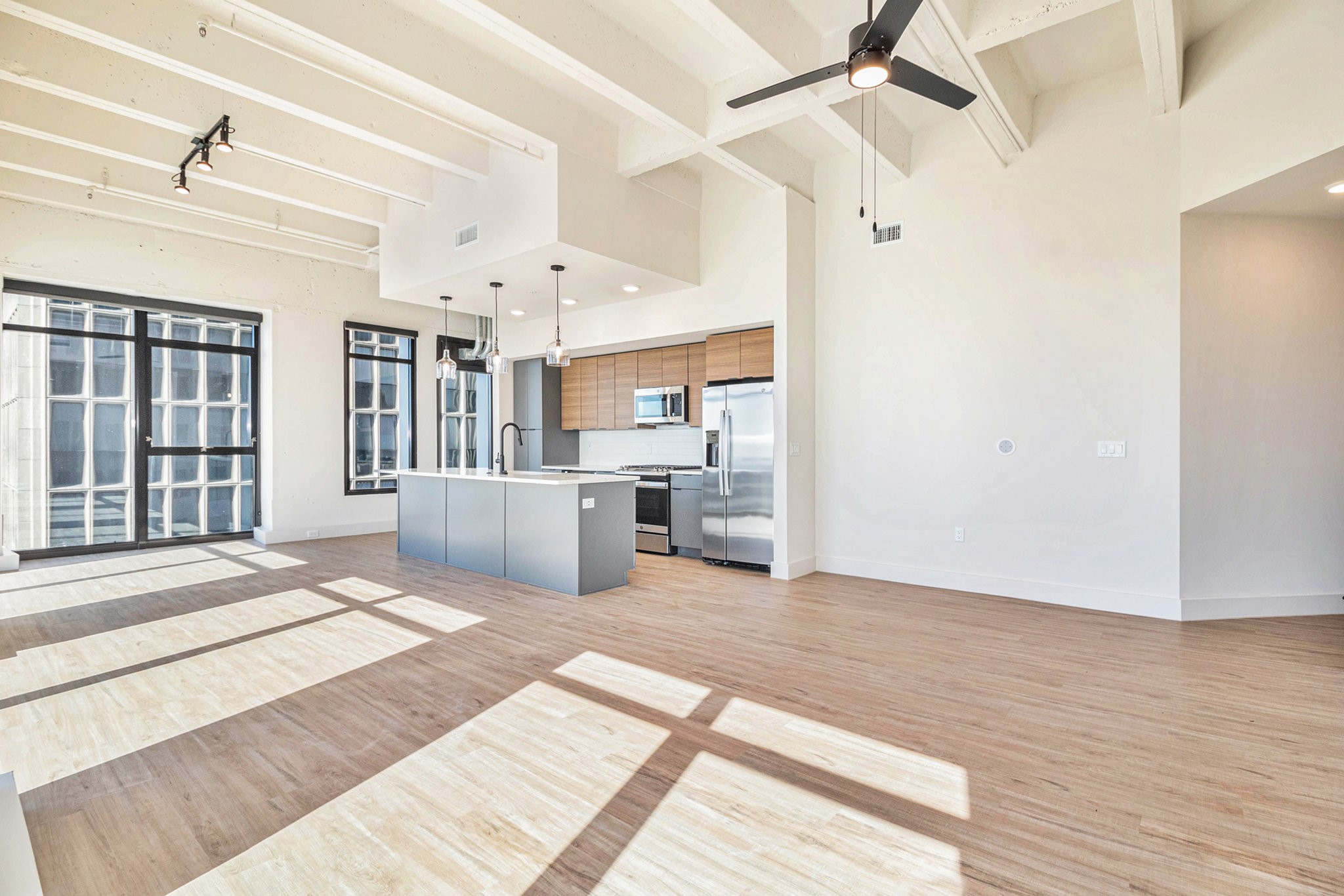 1801 Smith Street, Unit 2015 Houston, TX 77002 - Photo 5 of 28 a view of a kitchen with kitchen island wooden floor center island and stainless steel appliances