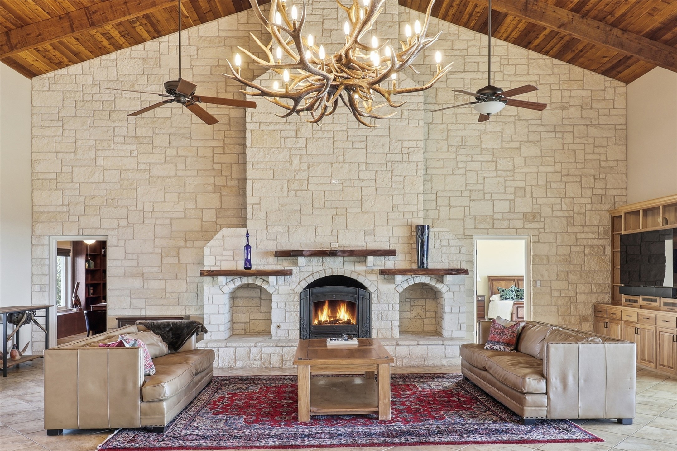 450 Threadgill Ranch Road Burnet, TX 78611 - Photo 4 of 33 a living room with furniture and a fireplace