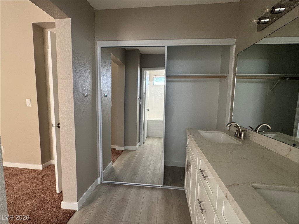 7447 Palermo Avenue Las Vegas, NV 89147 - Photo 11 of 26 Full bathroom with double vanity and closet #2