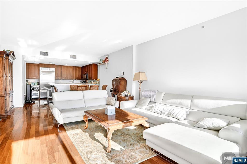 8100 River Road, Unit 801 North Bergen, NJ 07047 - Photo 15 of 48 a living room with furniture and a wooden floor