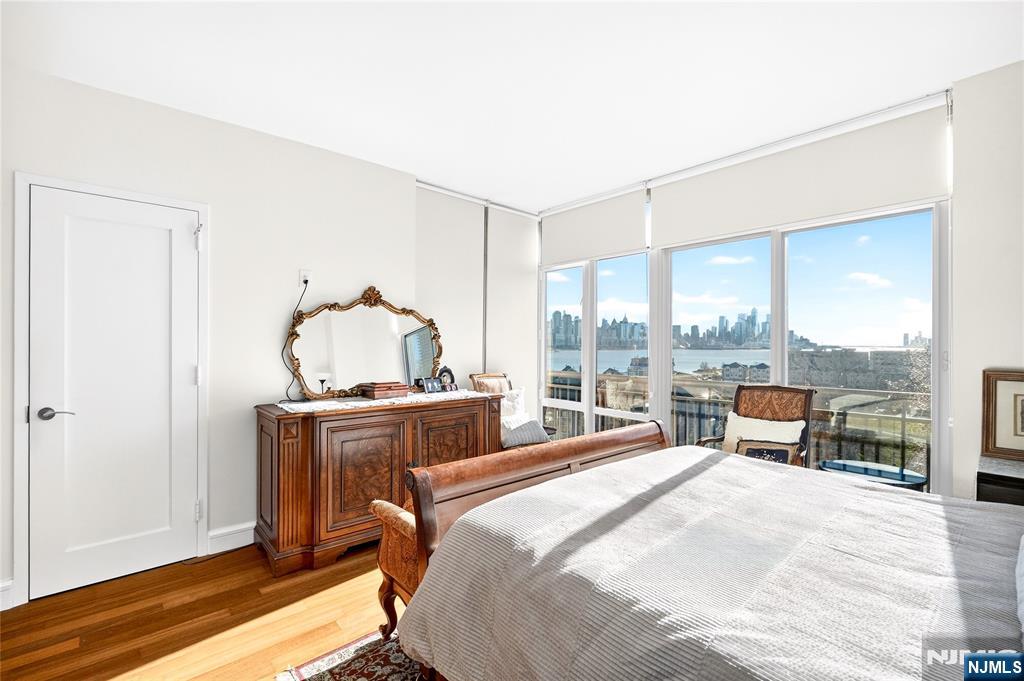 8100 River Road, Unit 801 North Bergen, NJ 07047 - Photo 30 of 48 a bedroom with a bed and a large window