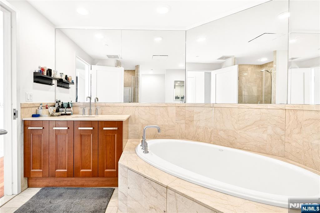 8100 River Road, Unit 801 North Bergen, NJ 07047 - Photo 34 of 48 a bathroom with a bathtub and a sink