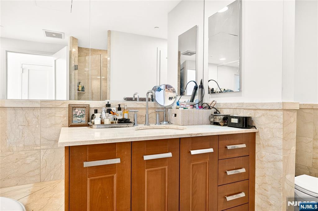 8100 River Road, Unit 801 North Bergen, NJ 07047 - Photo 36 of 48 a kitchen with sink stove and cabinets