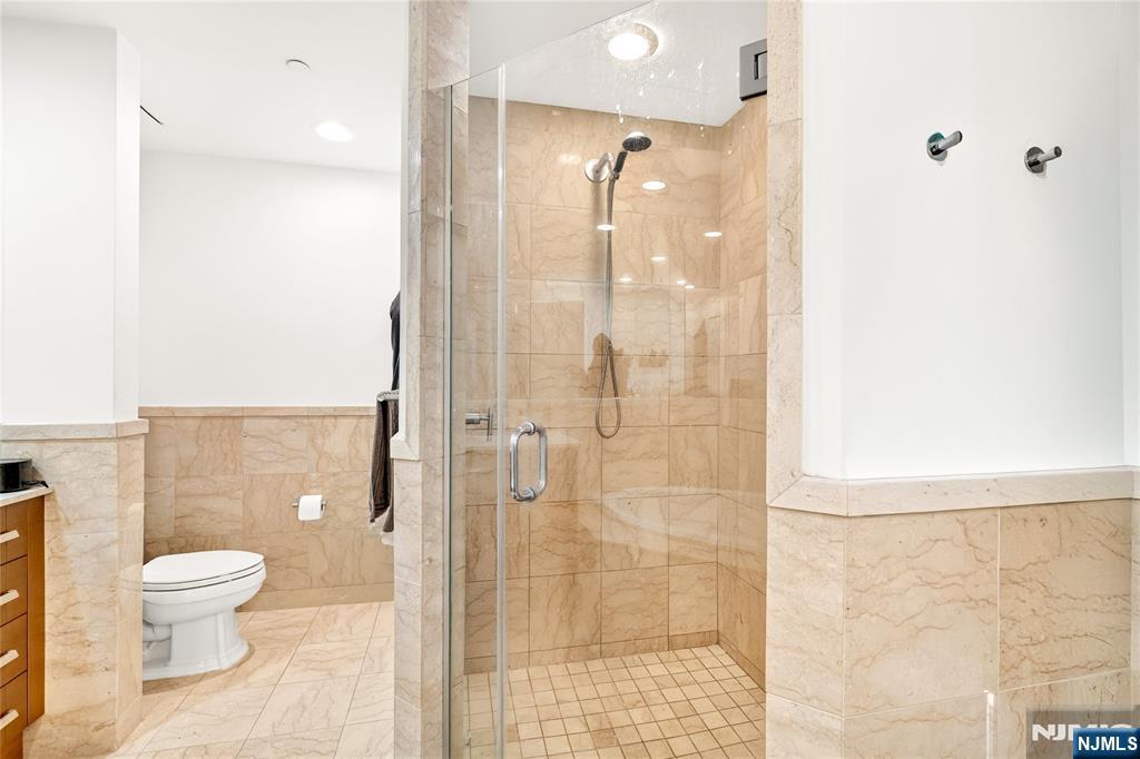 8100 River Road, Unit 801 North Bergen, NJ 07047 - Photo 37 of 48 a bathroom with a shower and a toilet
