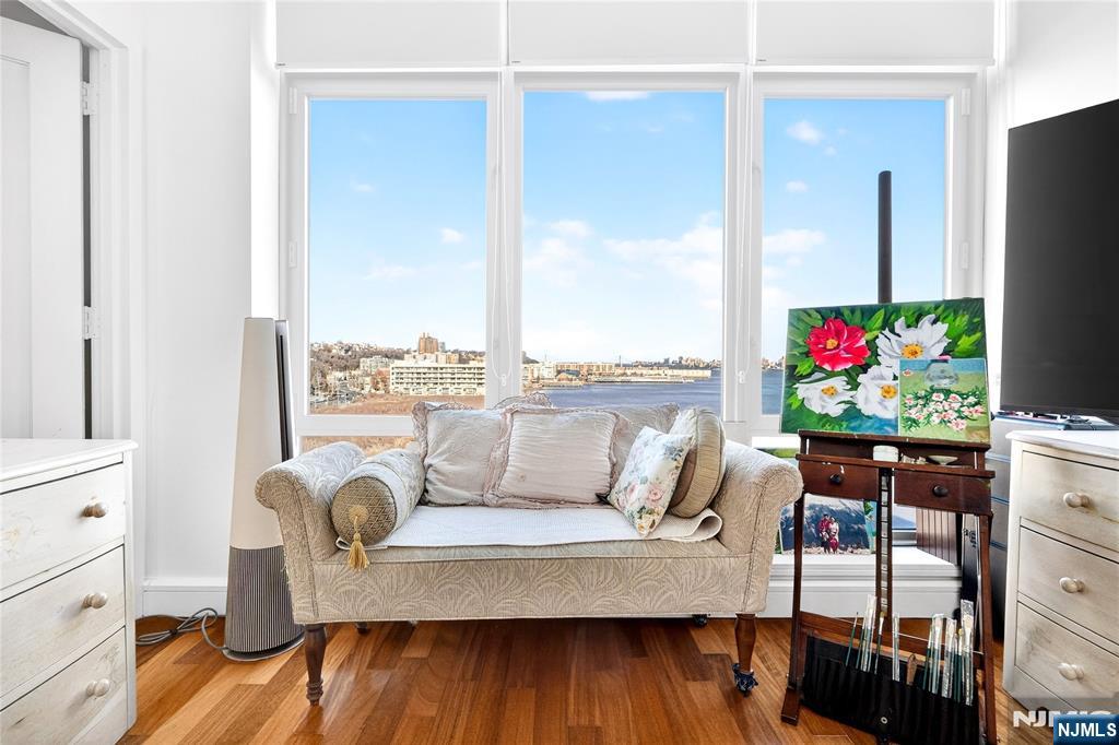 8100 River Road, Unit 801 North Bergen, NJ 07047 - Photo 39 of 48 a living room with furniture and a floor to ceiling window