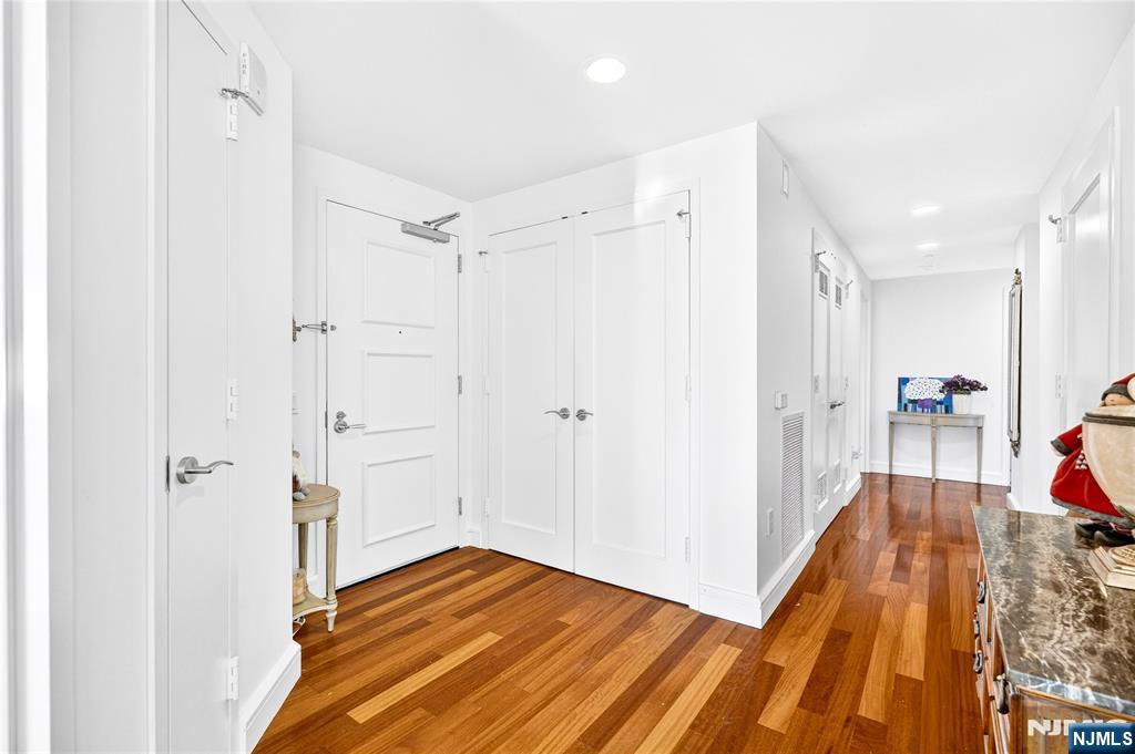 8100 River Road, Unit 801 North Bergen, NJ 07047 - Photo 6 of 48 a view of a bedroom with wooden floor and a bathroom