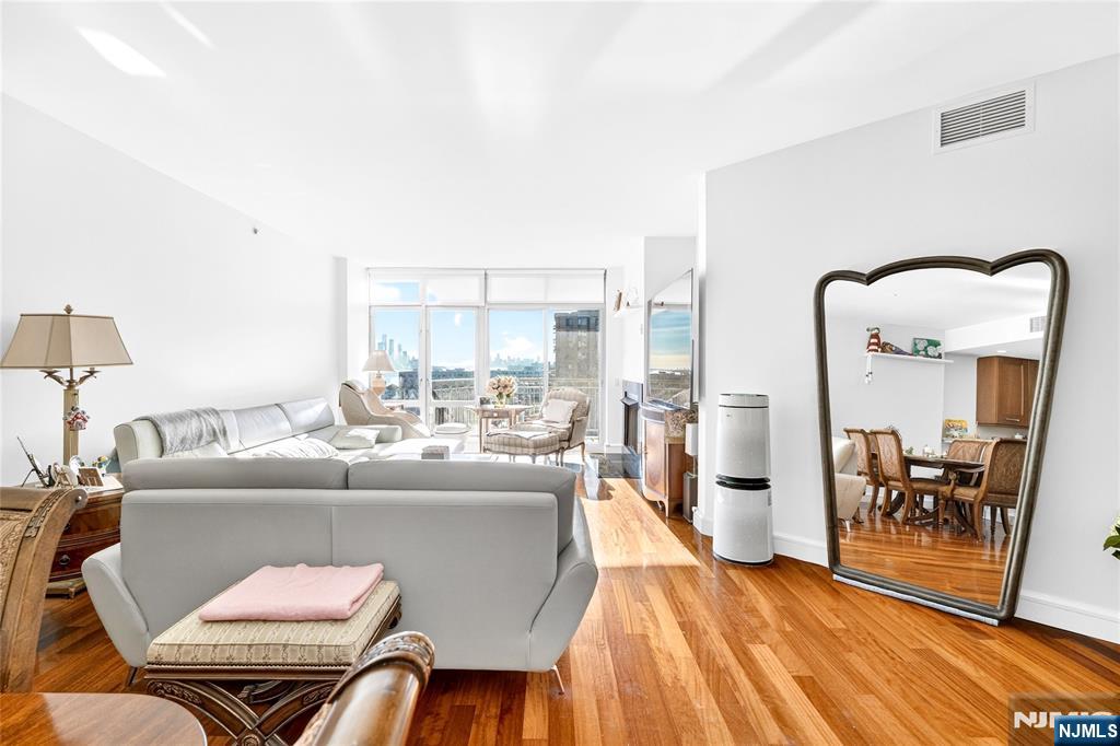 8100 River Road, Unit 801 North Bergen, NJ 07047 - Photo 7 of 48 a living room with furniture and a table