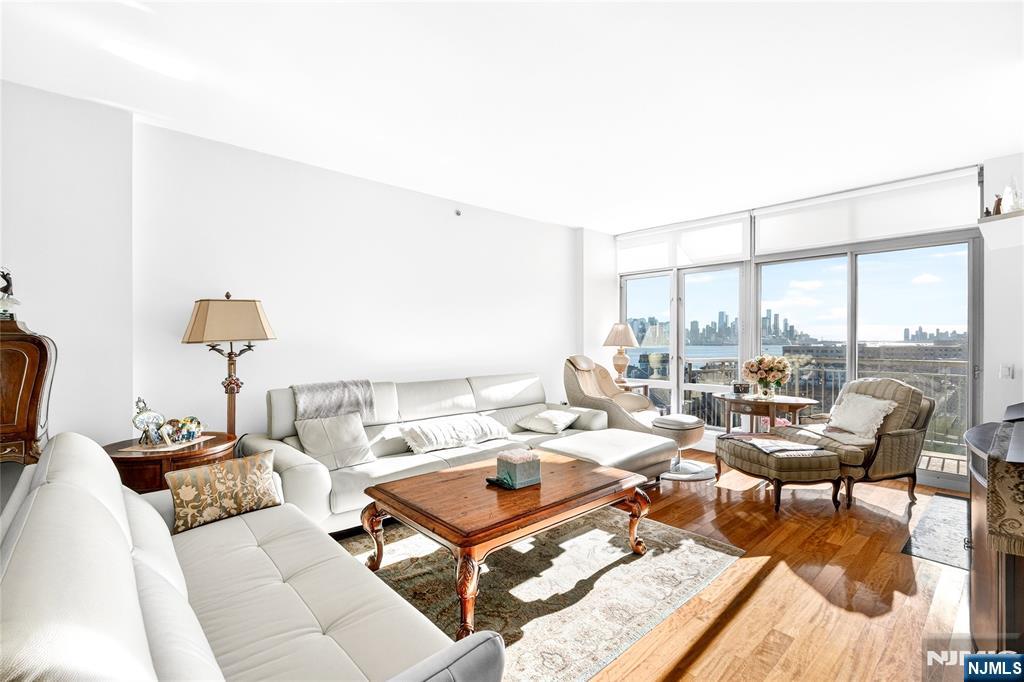 8100 River Road, Unit 801 North Bergen, NJ 07047 - Photo 8 of 48 a living room with furniture and a large window