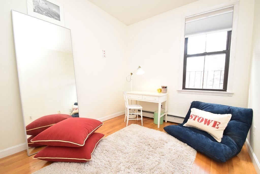 20 Concord Square, Unit 2 Boston, MA 02118 - Photo 13 of 16 a living room with furniture and a window