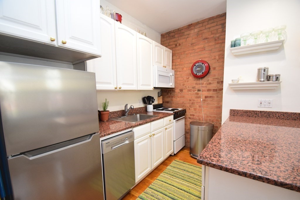20 Concord Square, Unit 2 Boston, MA 02118 - Photo 8 of 16 a kitchen with stainless steel appliances granite countertop a refrigerator and a stove