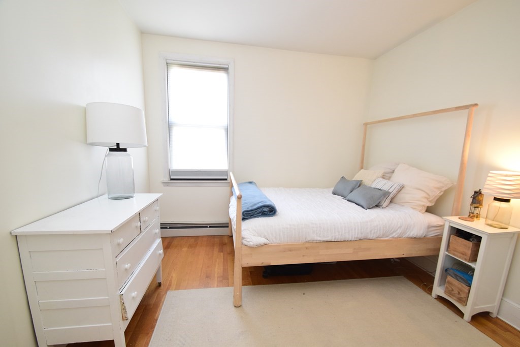 20 Concord Square, Unit 2 Boston, MA 02118 - Photo 10 of 16 a bedroom with a bed and a sink