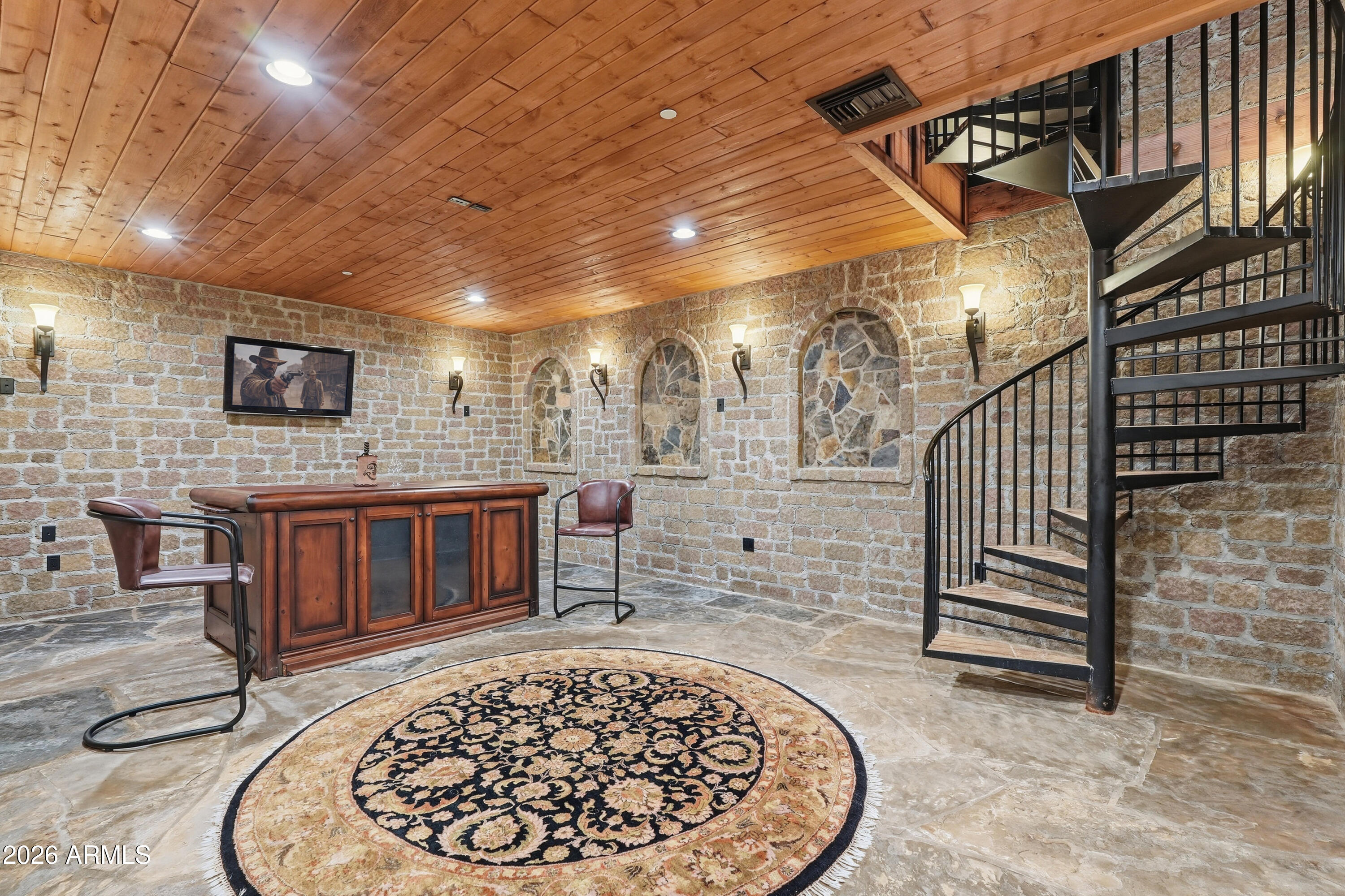 42531 North Spur Cross Road Cave Creek, AZ 85331 - Photo 14 of 75 a view of a hallway with wooden floor and a fireplace