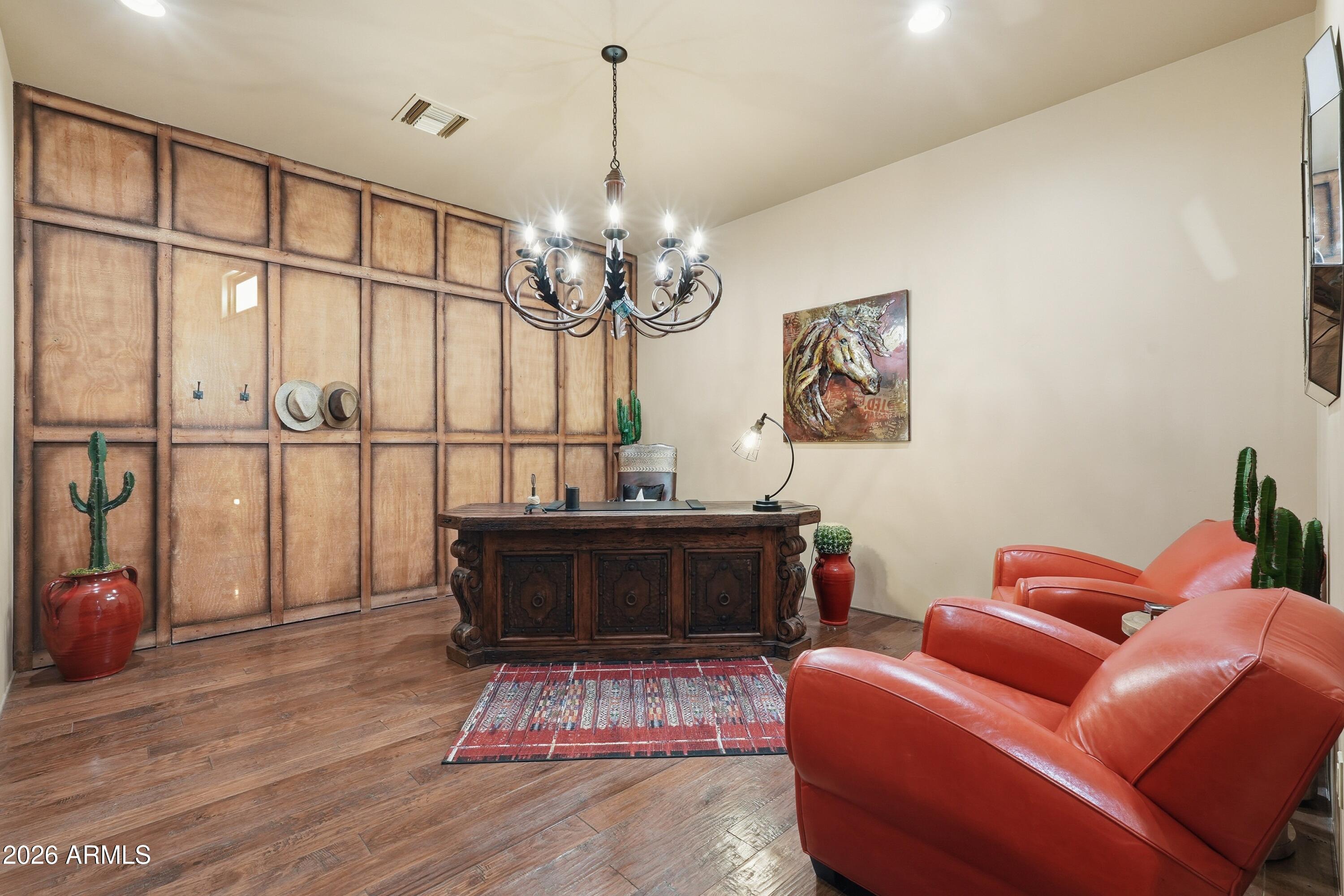 42531 North Spur Cross Road Cave Creek, AZ 85331 - Photo 17 of 75 a living room with furniture a dining table and a chandelier