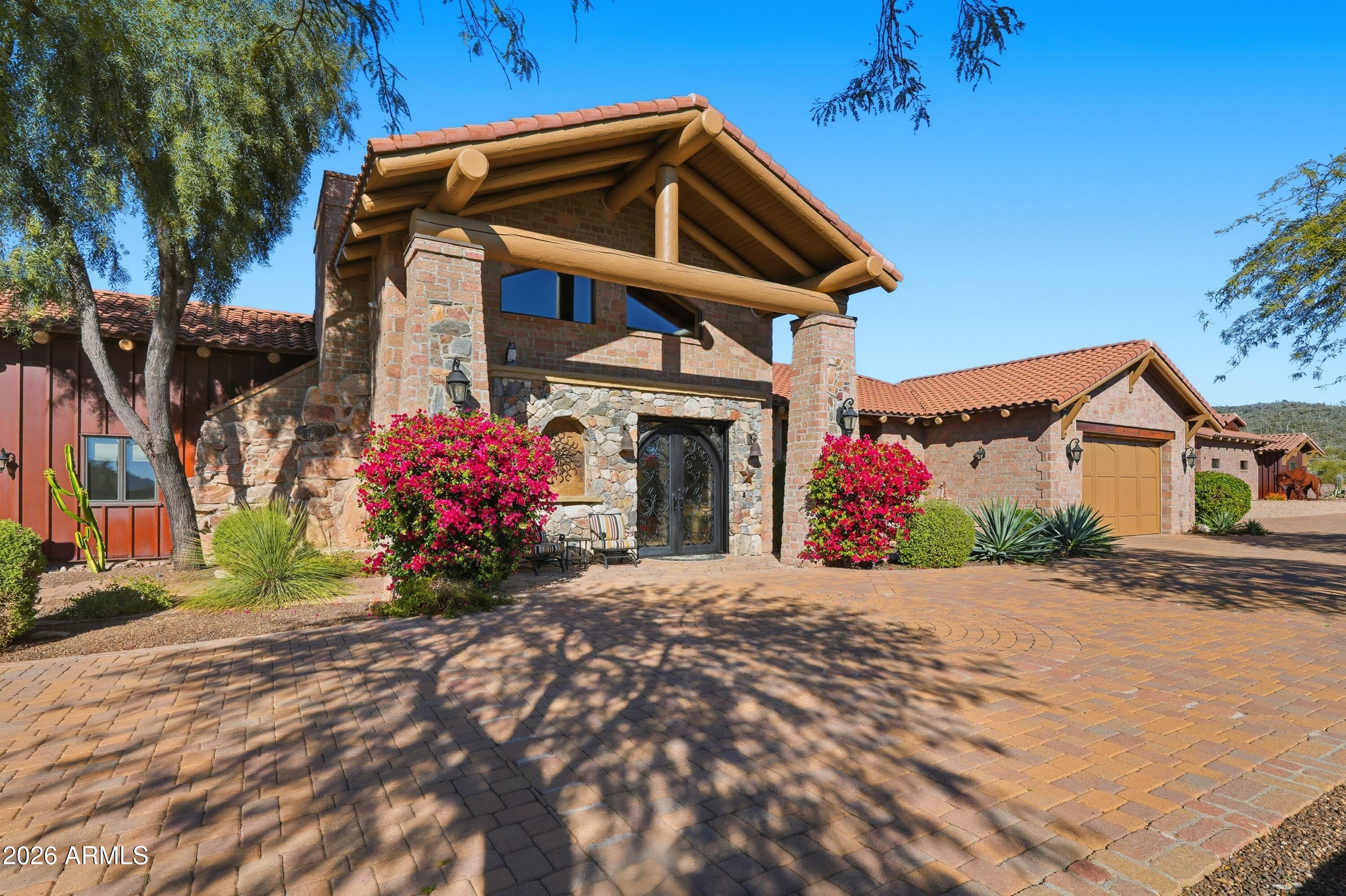 42531 North Spur Cross Road Cave Creek, AZ 85331 - Photo 3 of 75 a front view of a house with a garage