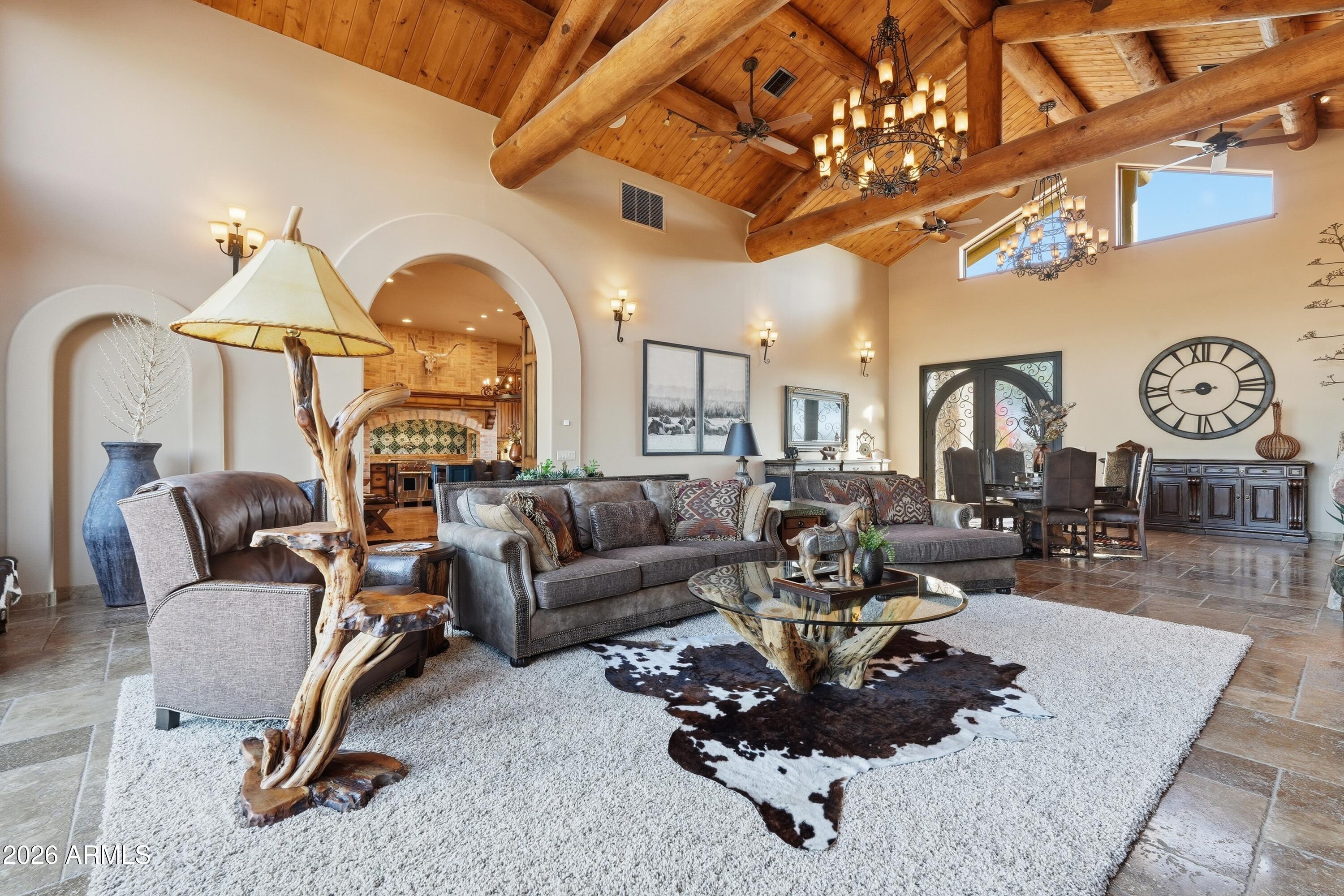42531 North Spur Cross Road Cave Creek, AZ 85331 - Photo 6 of 75 a living room with furniture a large window and a clock