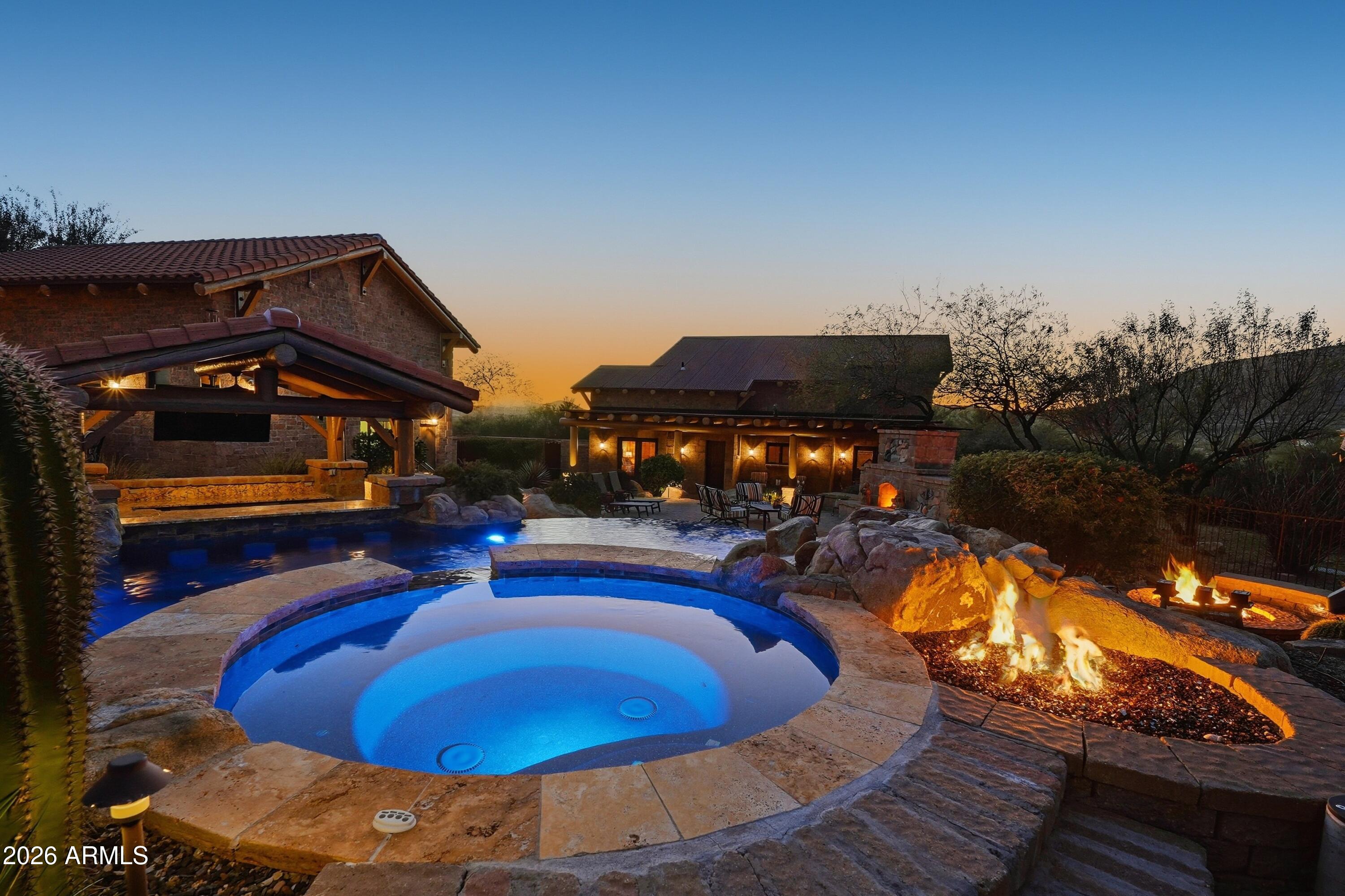 42531 North Spur Cross Road Cave Creek, AZ 85331 - Photo 66 of 75 a view of a swimming pool with an outdoor space and seating area