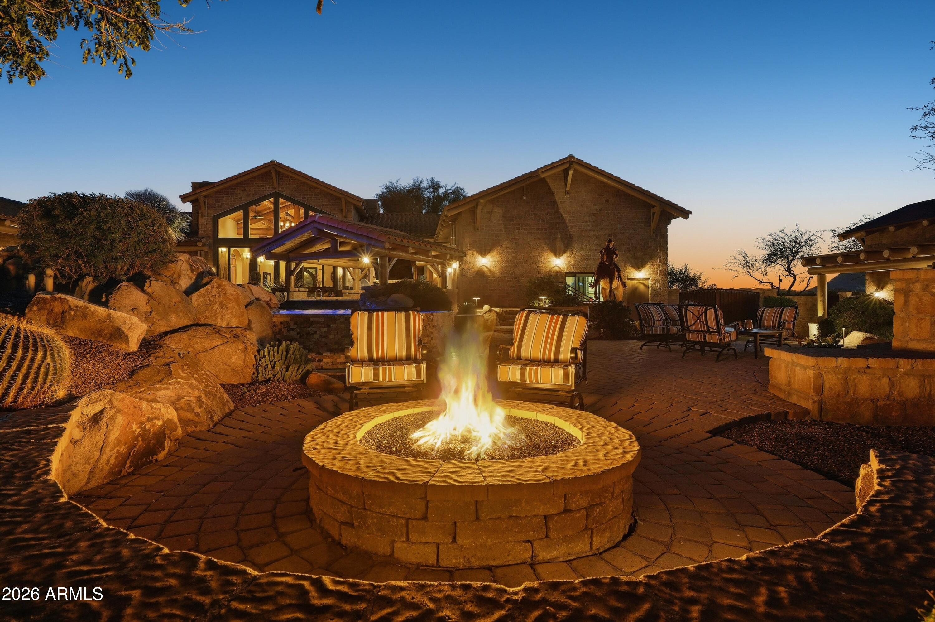42531 North Spur Cross Road Cave Creek, AZ 85331 - Photo 69 of 75 a view of a swimming pool with a table and chairs