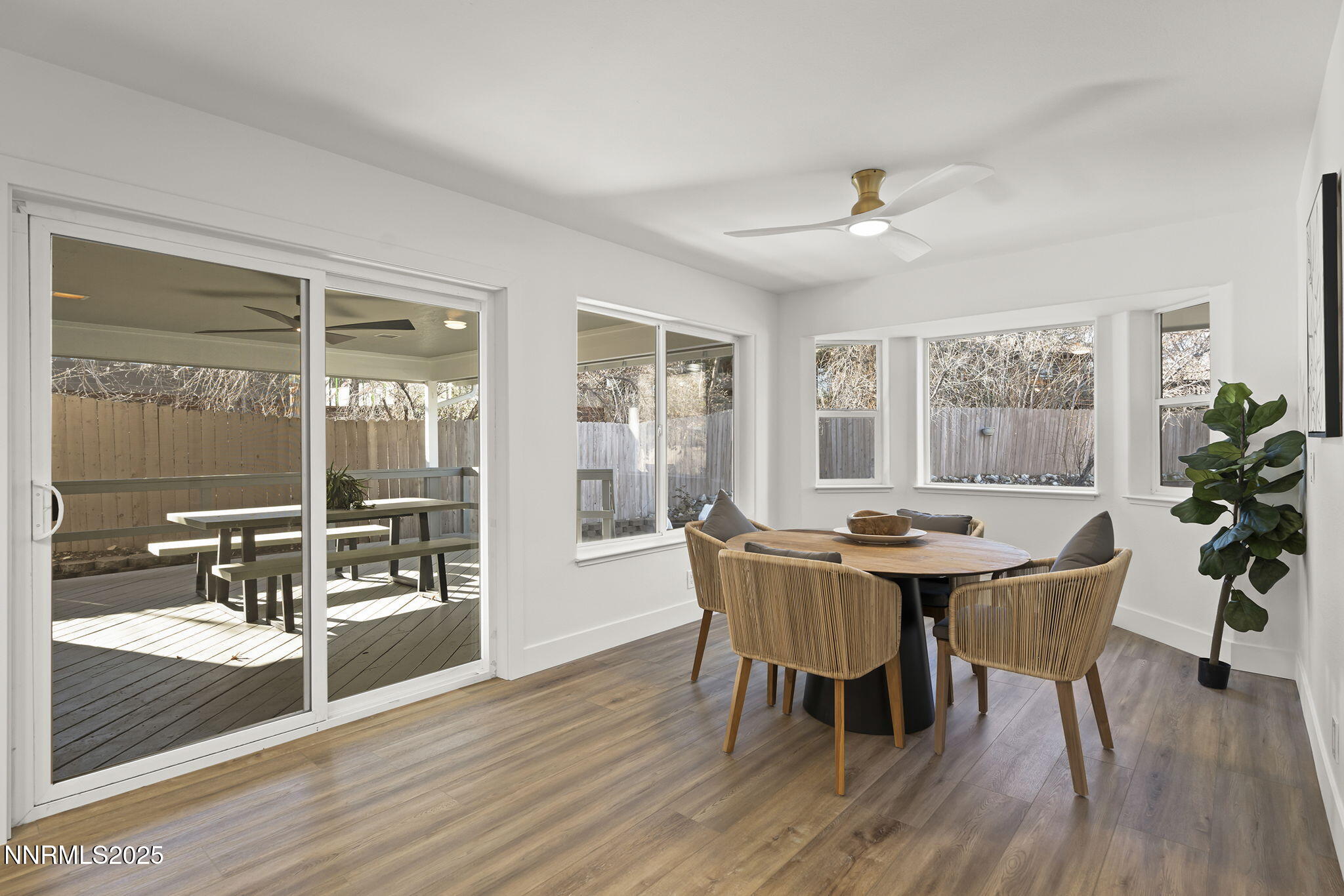1855 Hunter Lake Drive Reno, NV 89509 - Photo 19 of 37 a view of a dining room with furniture window and wooden floor