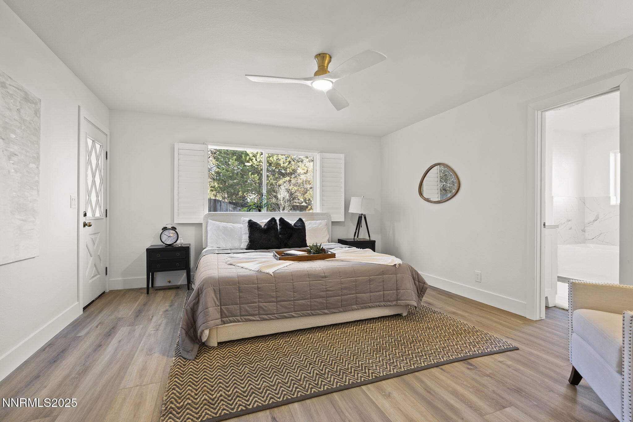 1855 Hunter Lake Drive Reno, NV 89509 - Photo 20 of 37 a bedroom with a bed and wooden floor