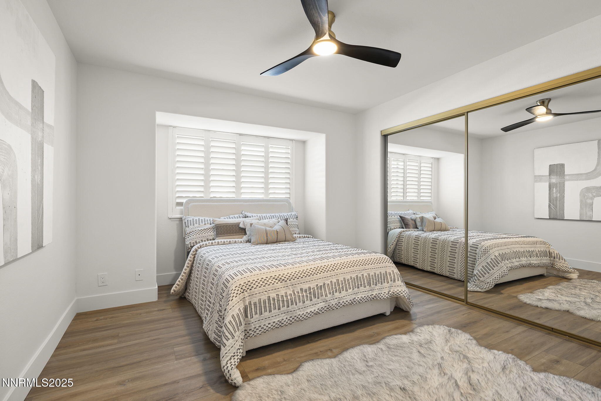 1855 Hunter Lake Drive Reno, NV 89509 - Photo 26 of 37 a bedroom with a large bed and a window