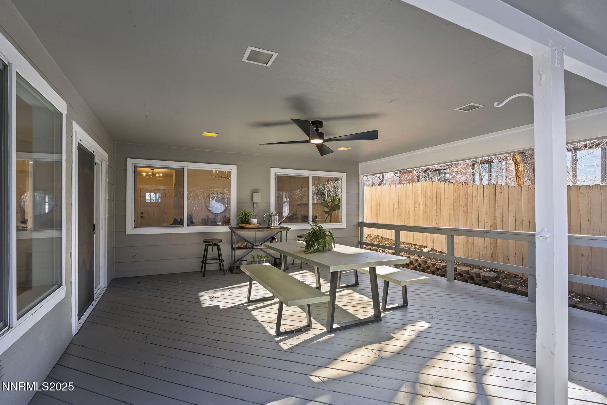 1855 Hunter Lake Drive Reno, NV 89509 - Photo 30 of 37 a living room with a table and chairs with wooden floor