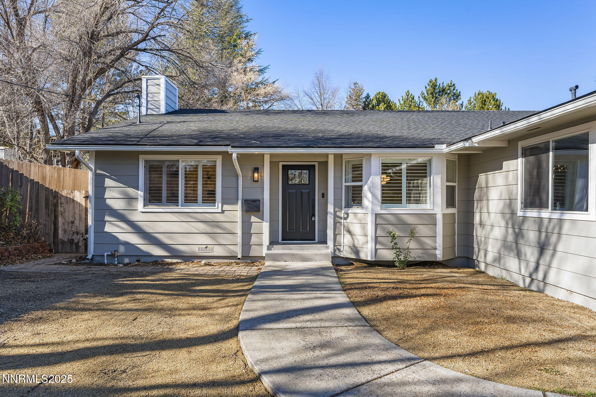 1855 Hunter Lake Drive Reno, NV 89509 - Photo 3 of 37 a front view of a house with a porch