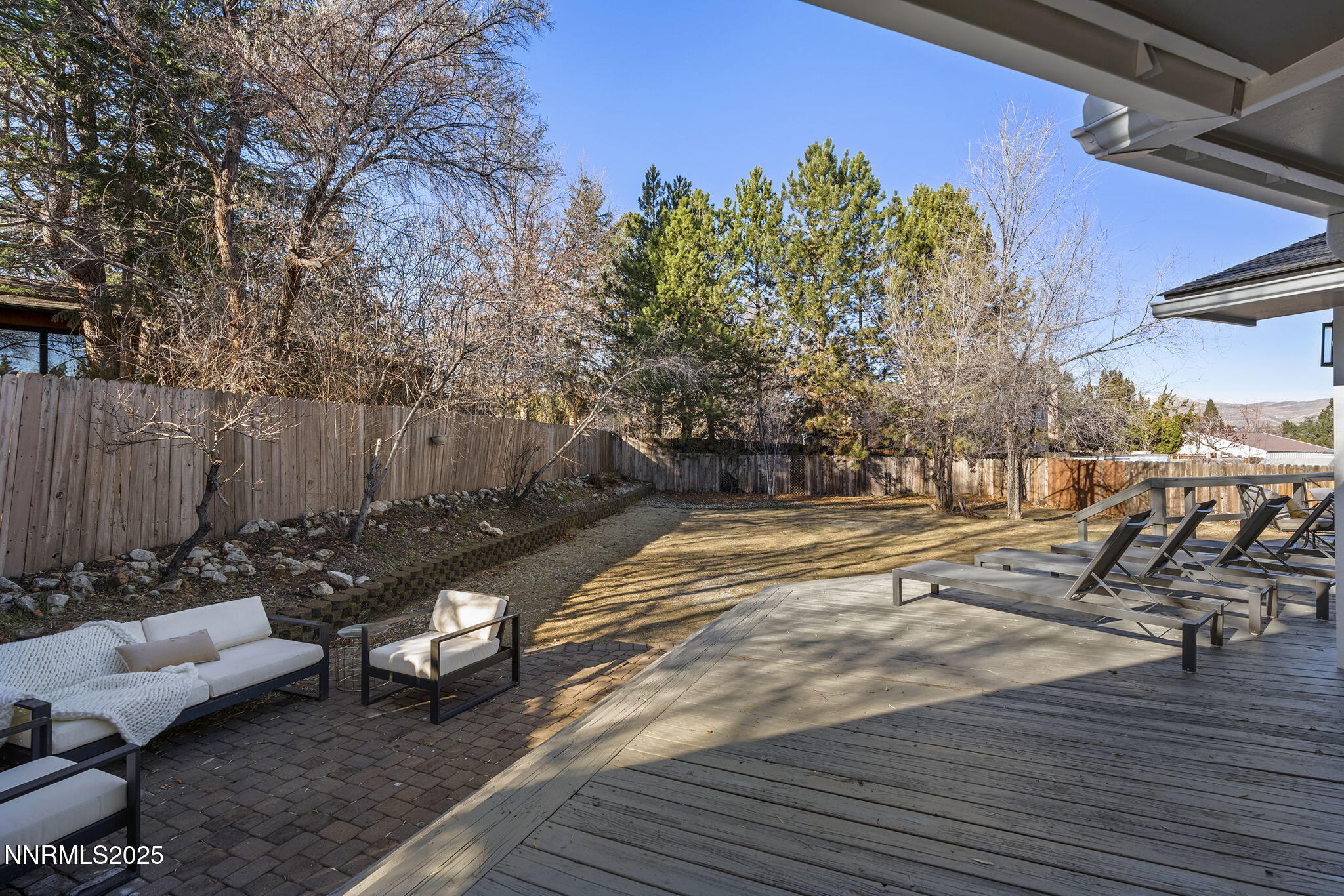 1855 Hunter Lake Drive Reno, NV 89509 - Photo 31 of 37 a swimming pool with outdoor seating and covered with trees