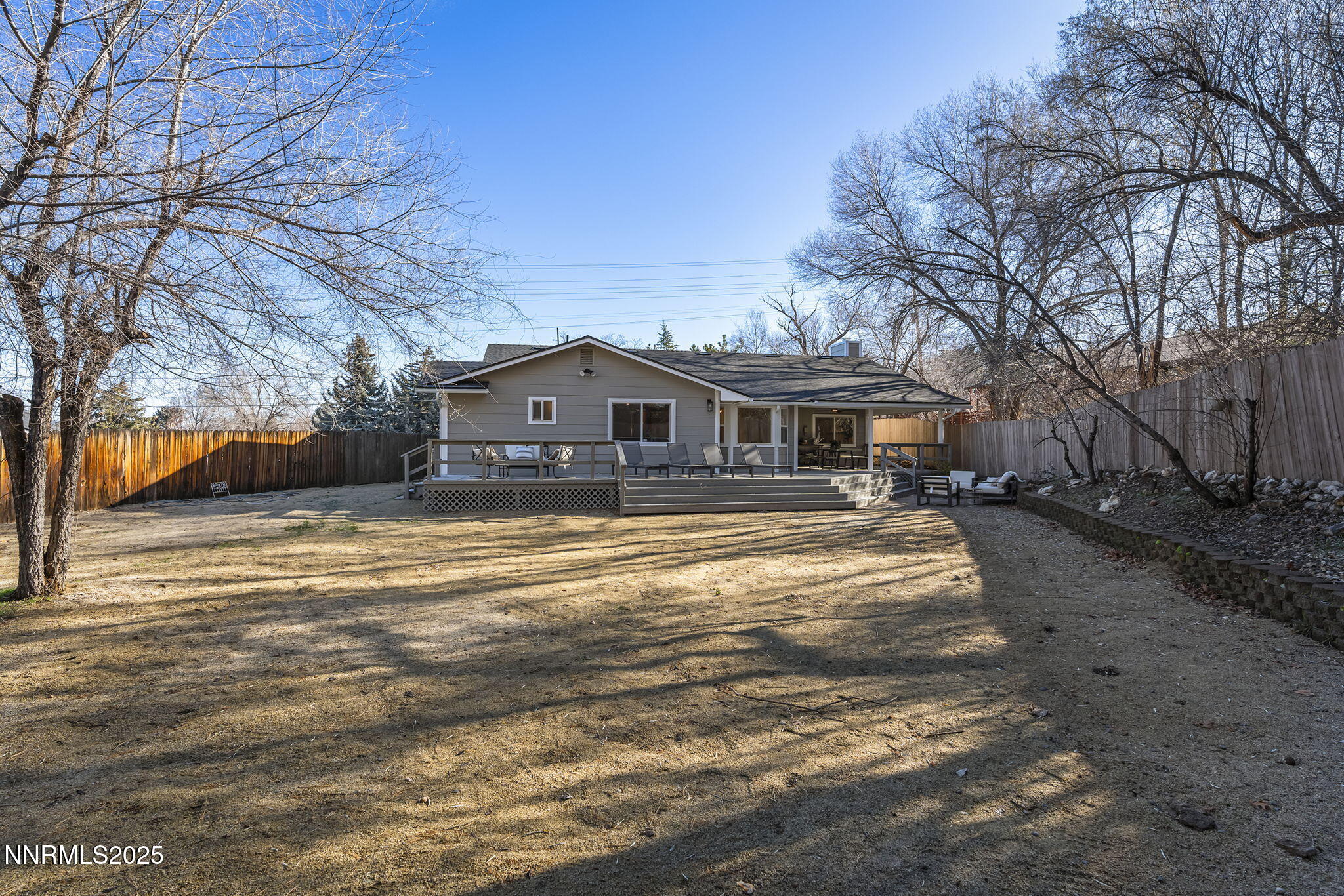 1855 Hunter Lake Drive Reno, NV 89509 - Photo 36 of 37 a view of house with yard and car parked