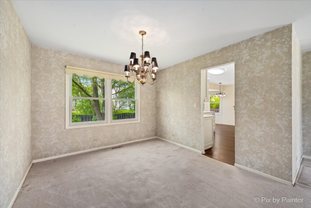 1184 Devonshire Road Buffalo Grove, IL 60089 - Photo 8 of 33 an empty room with windows and entrance