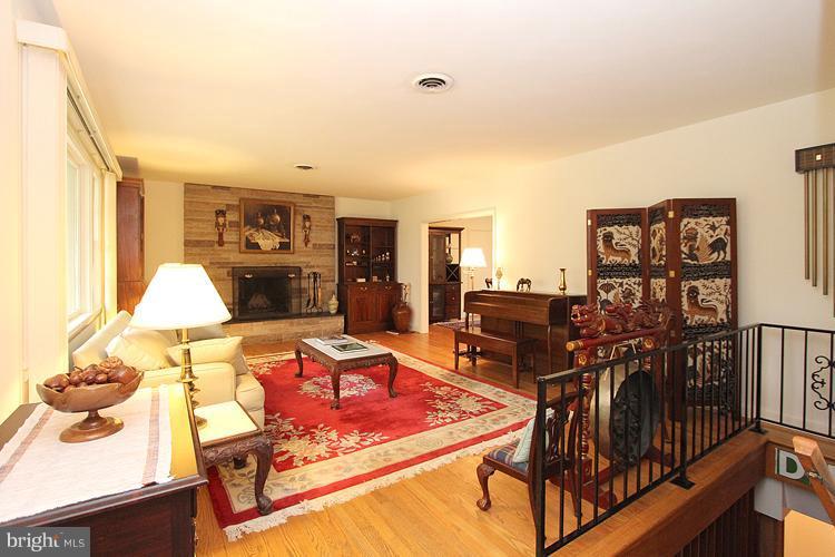 6100 Walhonding Road Bethesda, MD 20816 - Photo 12 of 30 Living Room with stone fireplace