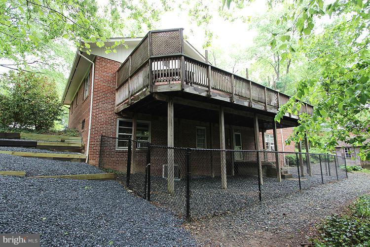 6100 Walhonding Road Bethesda, MD 20816 - Photo 8 of 30 Area under deck fenced for dog