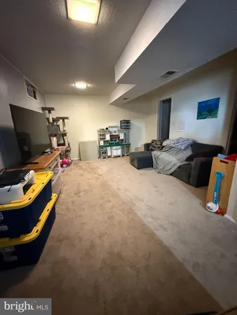 a bed room with furniture and a flat screen tv