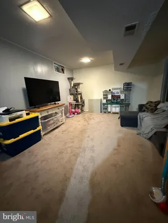 a room with furniture and a flat screen tv