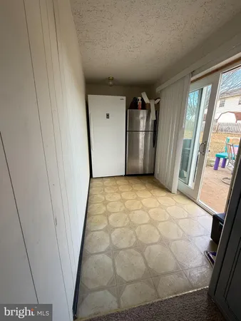 a view of an empty room and a window