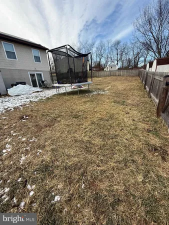 a view of a backyard of the house