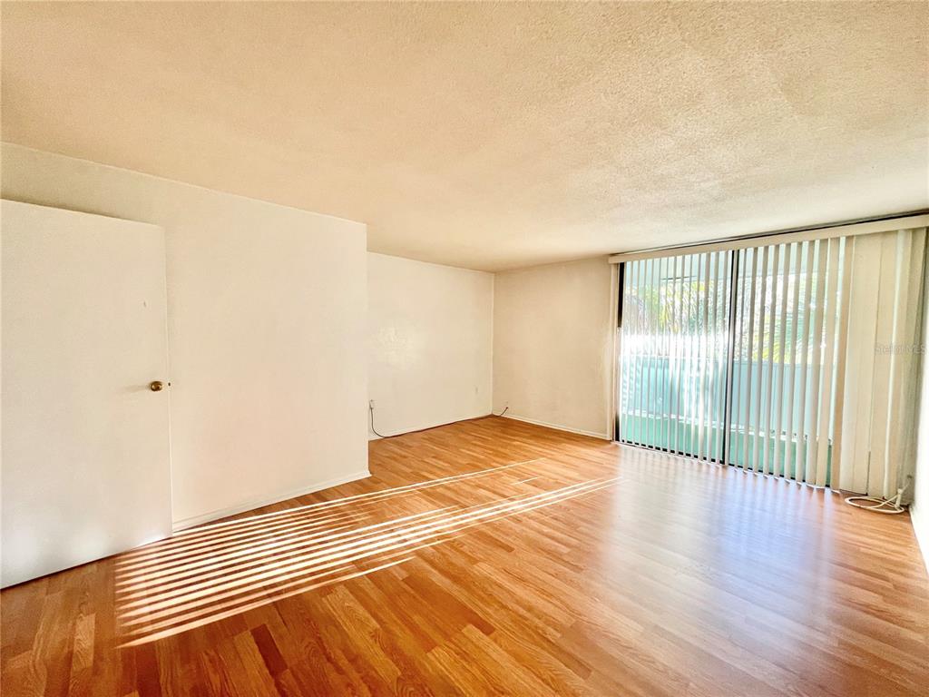 719 Southwest 75th Street, Unit 103 Gainesville, FL 32607 - Photo 23 of 39 a view of a room with wooden floor