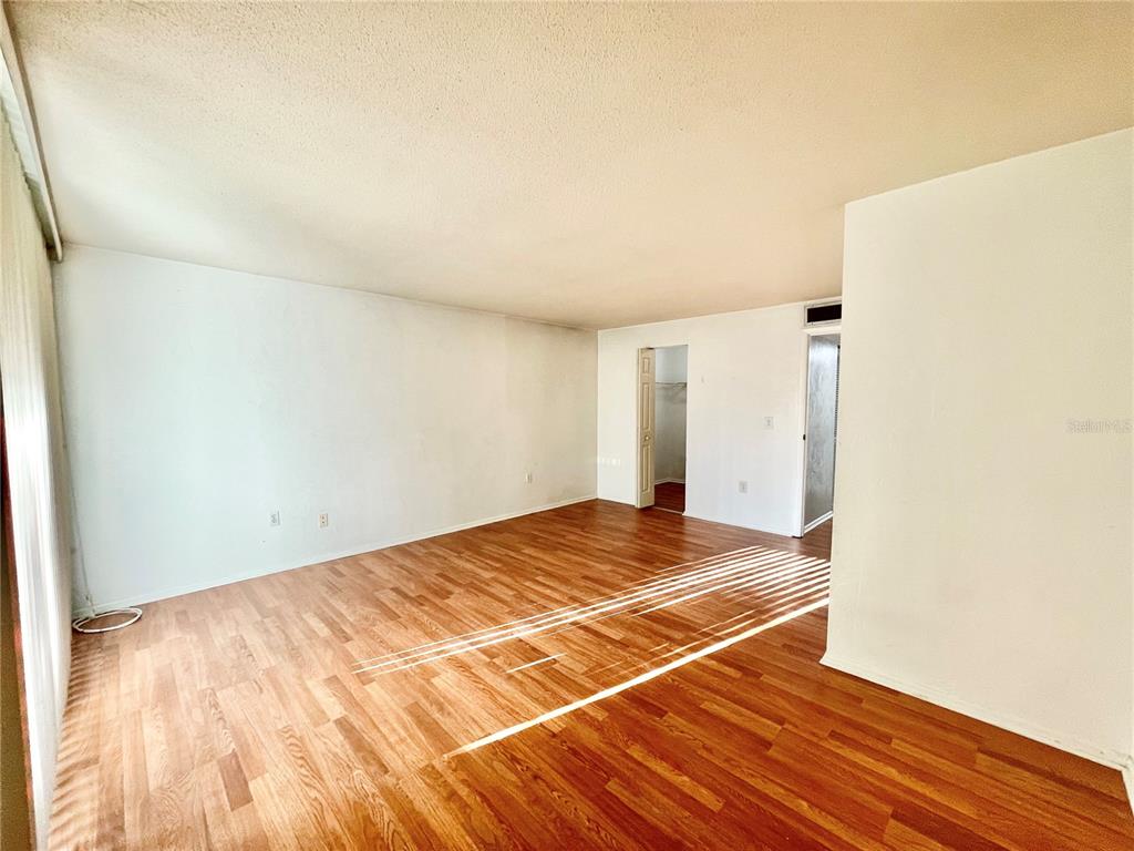 719 Southwest 75th Street, Unit 103 Gainesville, FL 32607 - Photo 26 of 39 a view of a room with wooden floor