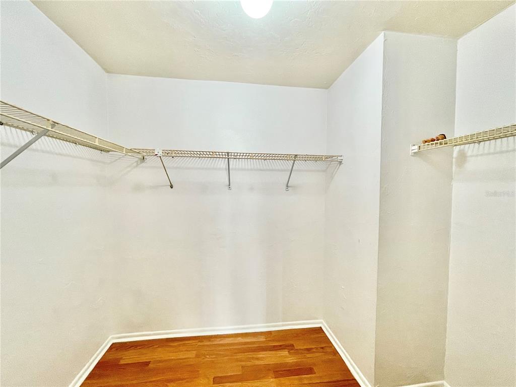 719 Southwest 75th Street, Unit 103 Gainesville, FL 32607 - Photo 27 of 39 a view of a room with racks on the wall