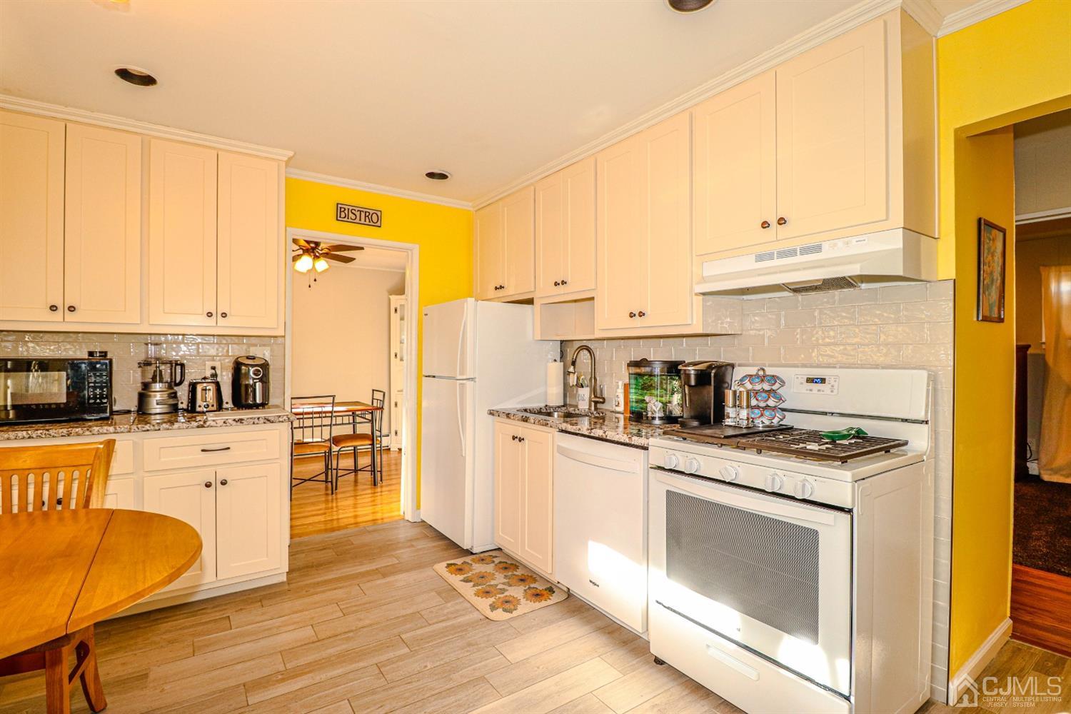 7 Dayton Road Edison, NJ 08817 - Photo 11 of 25 a kitchen with stainless steel appliances granite countertop a stove a sink dishwasher and a refrigerator