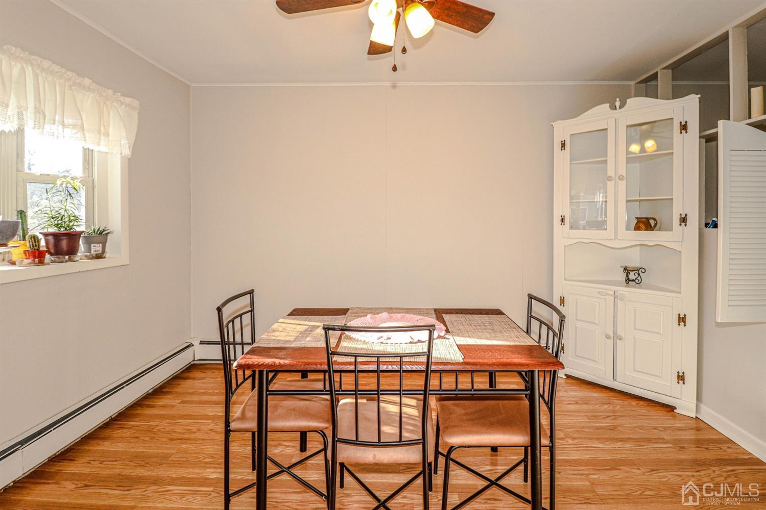 7 Dayton Road Edison, NJ 08817 - Photo 13 of 25 a view of a dining room with furniture and wooden floor