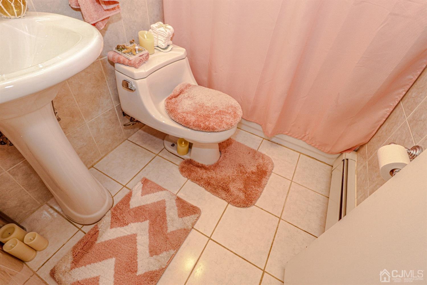 7 Dayton Road Edison, NJ 08817 - Photo 18 of 25 a bathroom with a sink and toilet