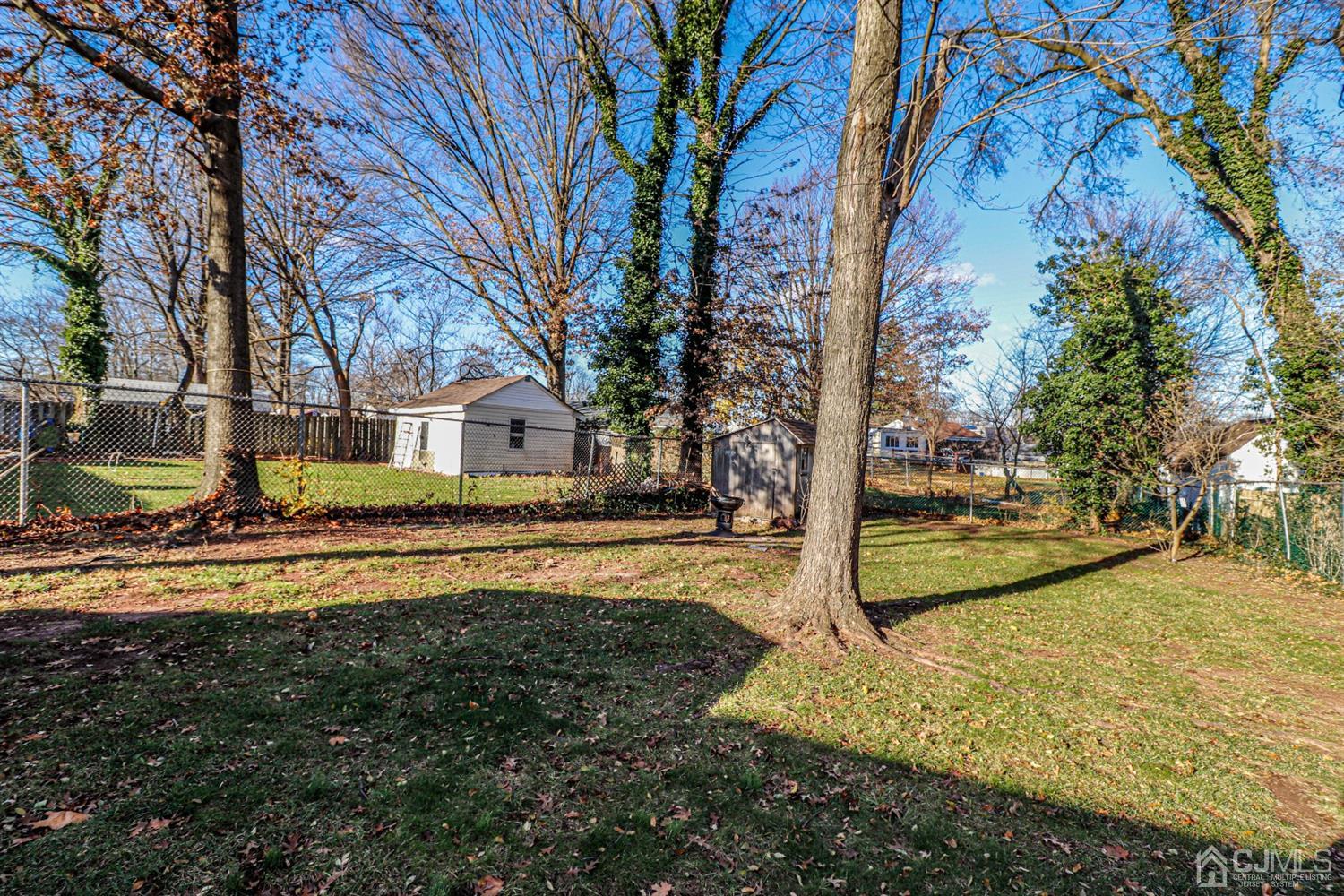 7 Dayton Road Edison, NJ 08817 - Photo 25 of 25 a view of a house with large trees and a yard