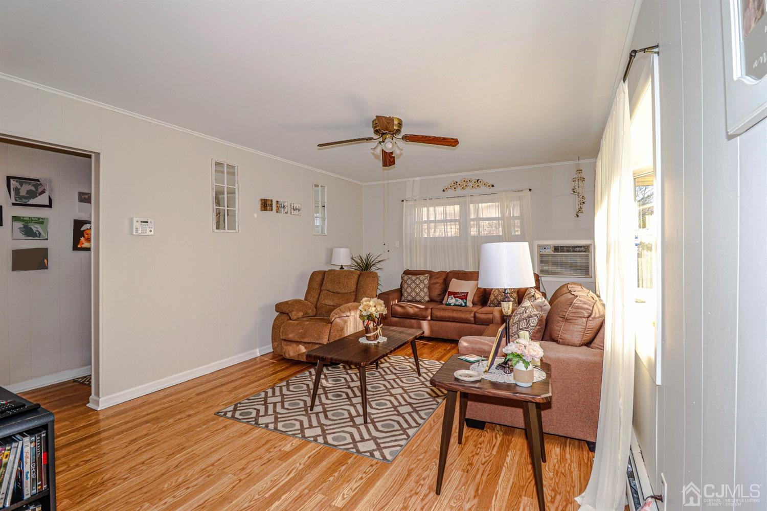 7 Dayton Road Edison, NJ 08817 - Photo 5 of 25 a living room with furniture and wooden floor
