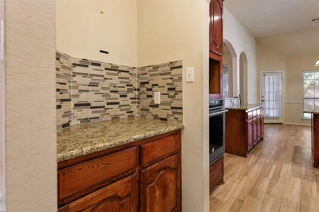 a view of a kitchen cabinets and wooden floor