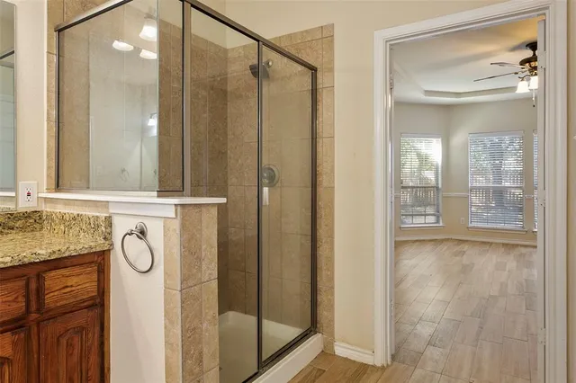 a bathroom with a shower and a sink