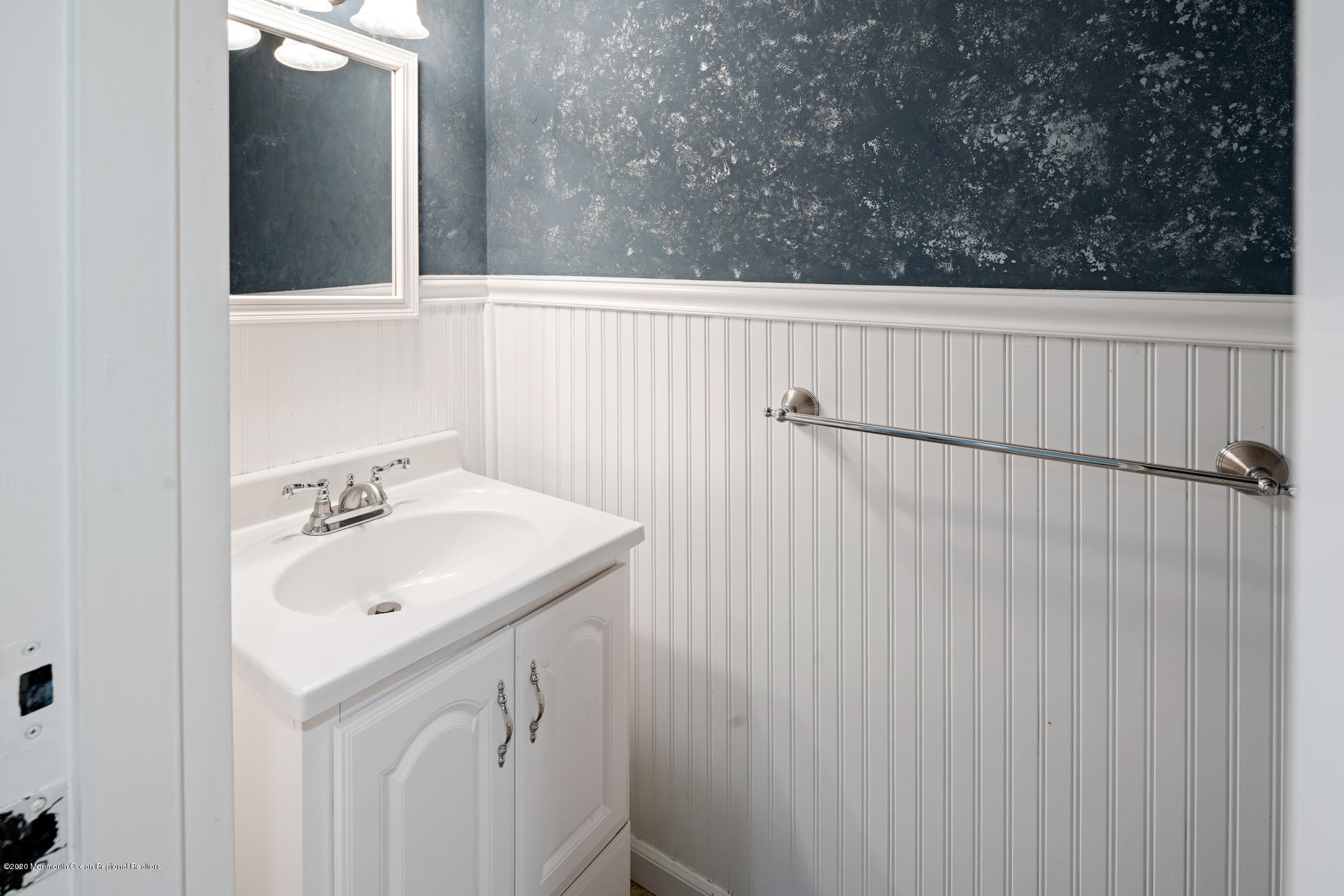 321 Spring Street, Unit 29 Red Bank, NJ 07701 - Photo 8 of 21 a bathroom with a sink and vanity