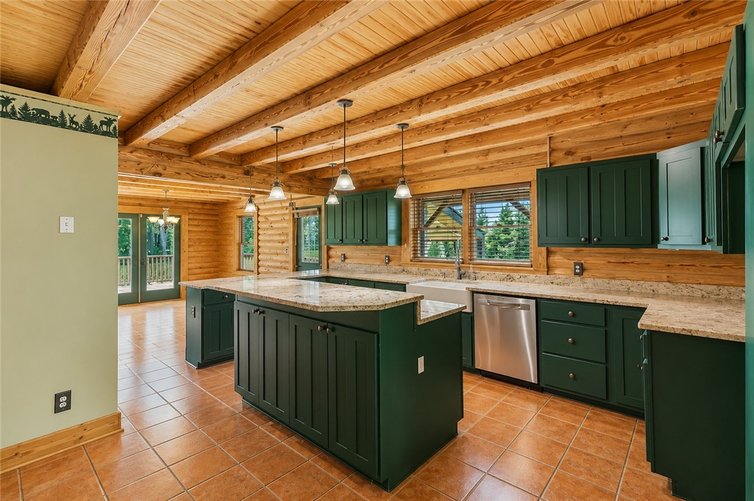 414 Devon Way Anderson, SC 29621 - Photo 10 of 50 Crafted from rich timber, this kitchen boasts an island and stainless steel appliances.