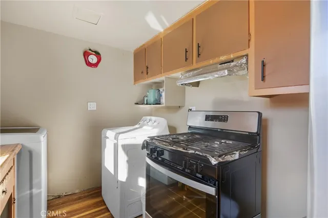 a stove top oven sitting inside of a kitchen
